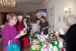 Coffee is served….residents enjoying the refreshments at Macmillan fundraiser.