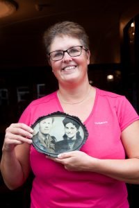 Woman with photograph of parents at Woodville Co-op coffee morning